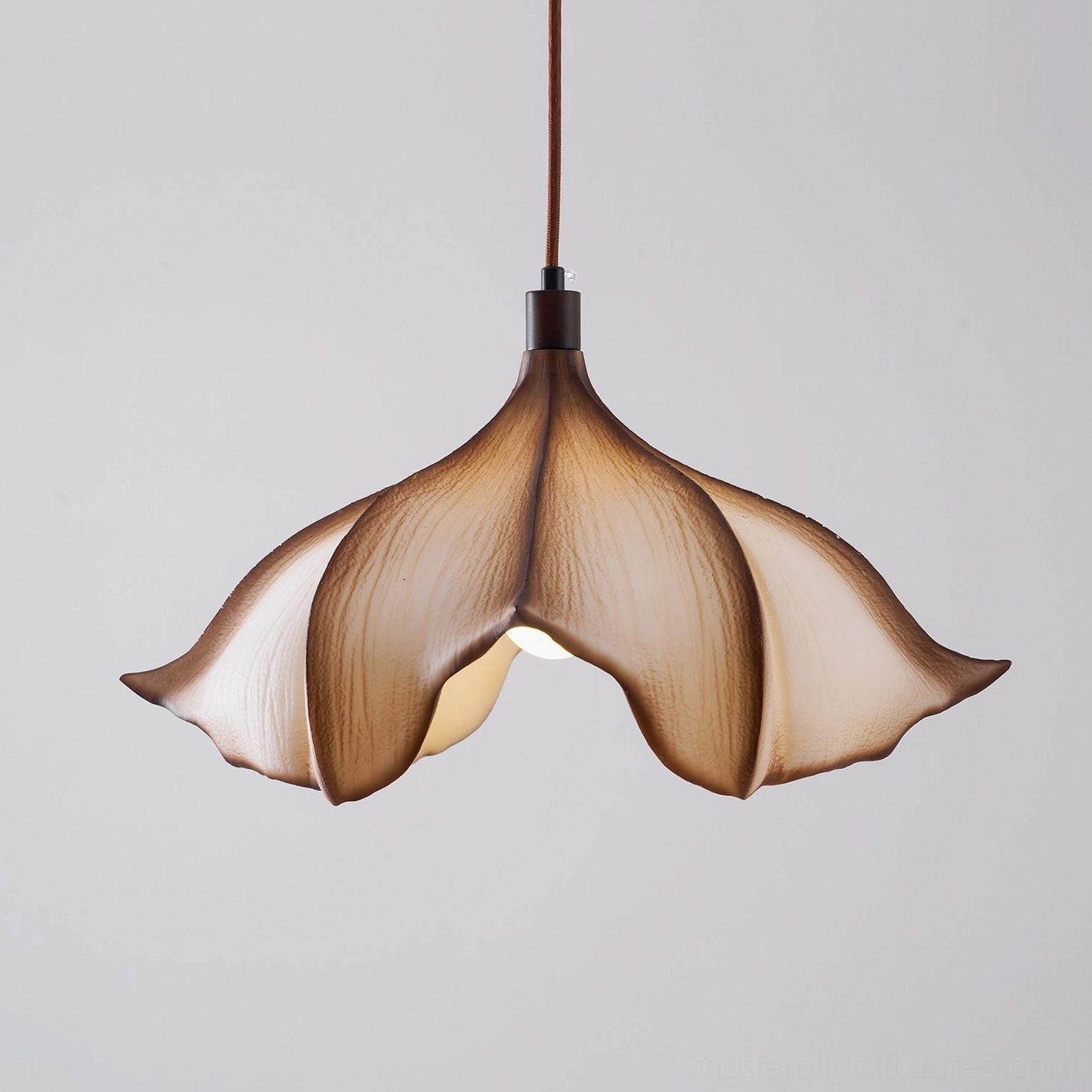 Calysa organic petal pendant light three-quarter angle view highlighting curved sculptural silhouette design