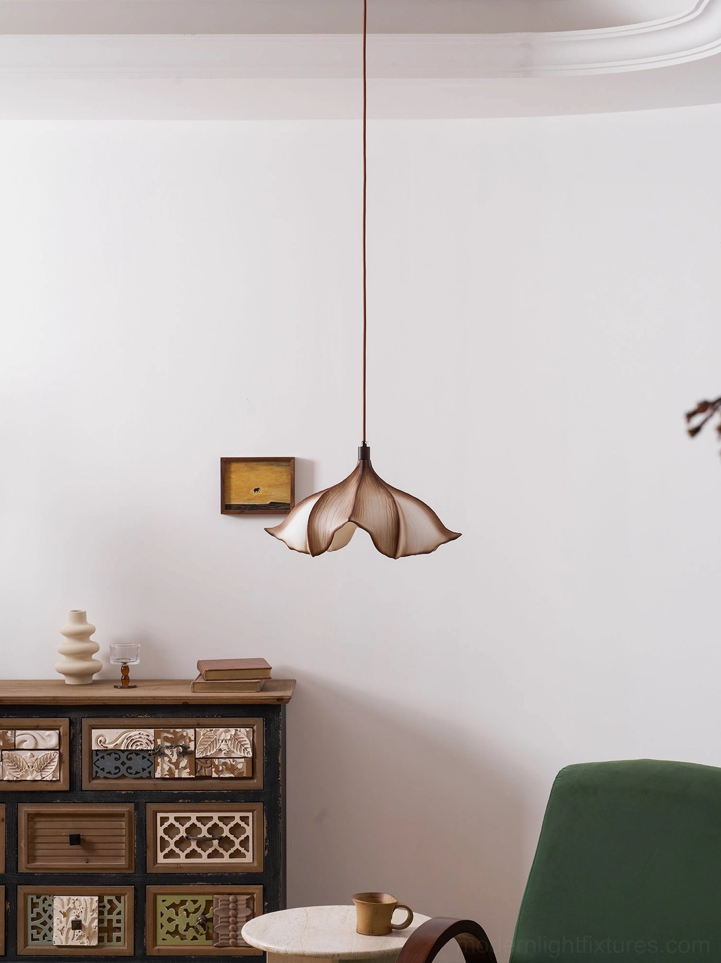 Calysa organic petal pendant light creating warm ambient illumination in contemporary residential interior