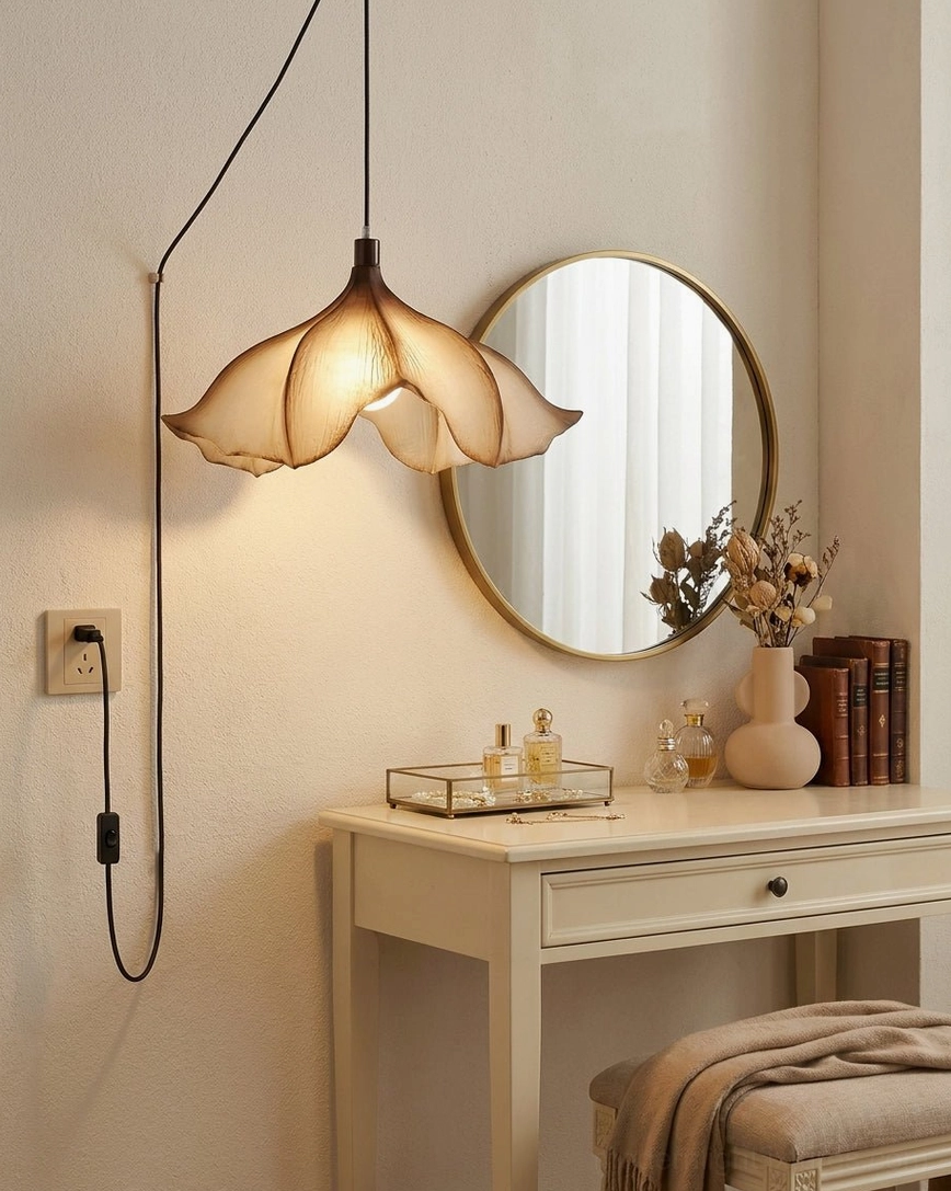 Calysa plug-in petal pendant light hung above vanity mirror in minimalist boho bedroom corner, providing focused accent lighting for dressing area