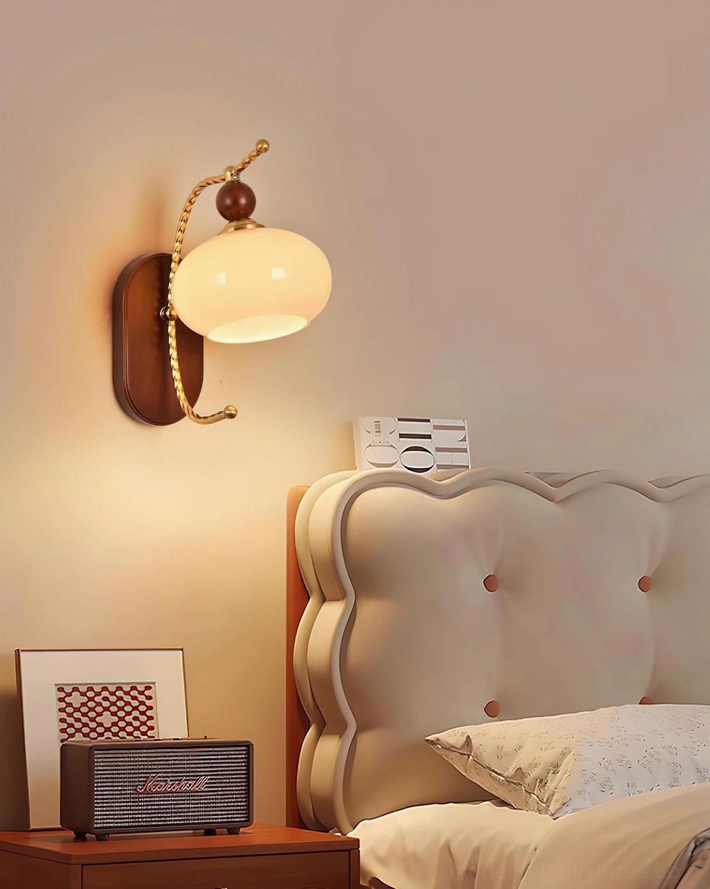 Calyx mid-century modern wall lamp with botanical glass shade and twisted brass arm fixture