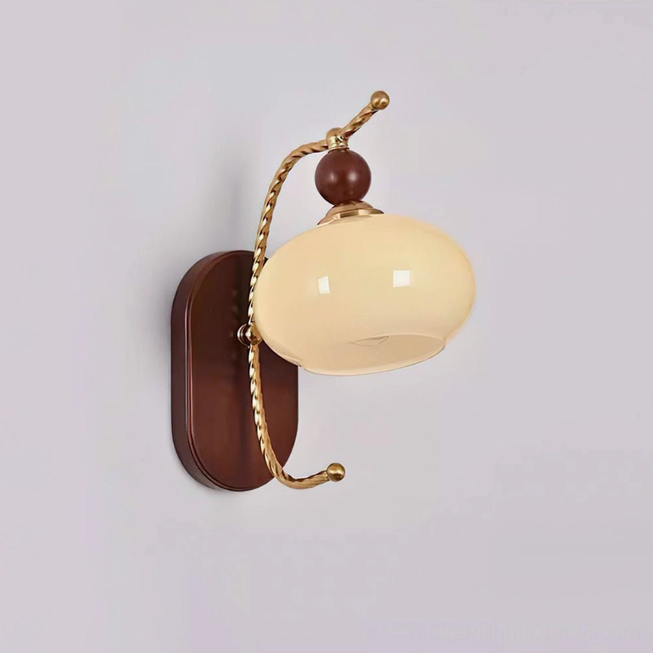 Calyx model D wall sconce with beige lampshade and gold walnut color brass metalwork