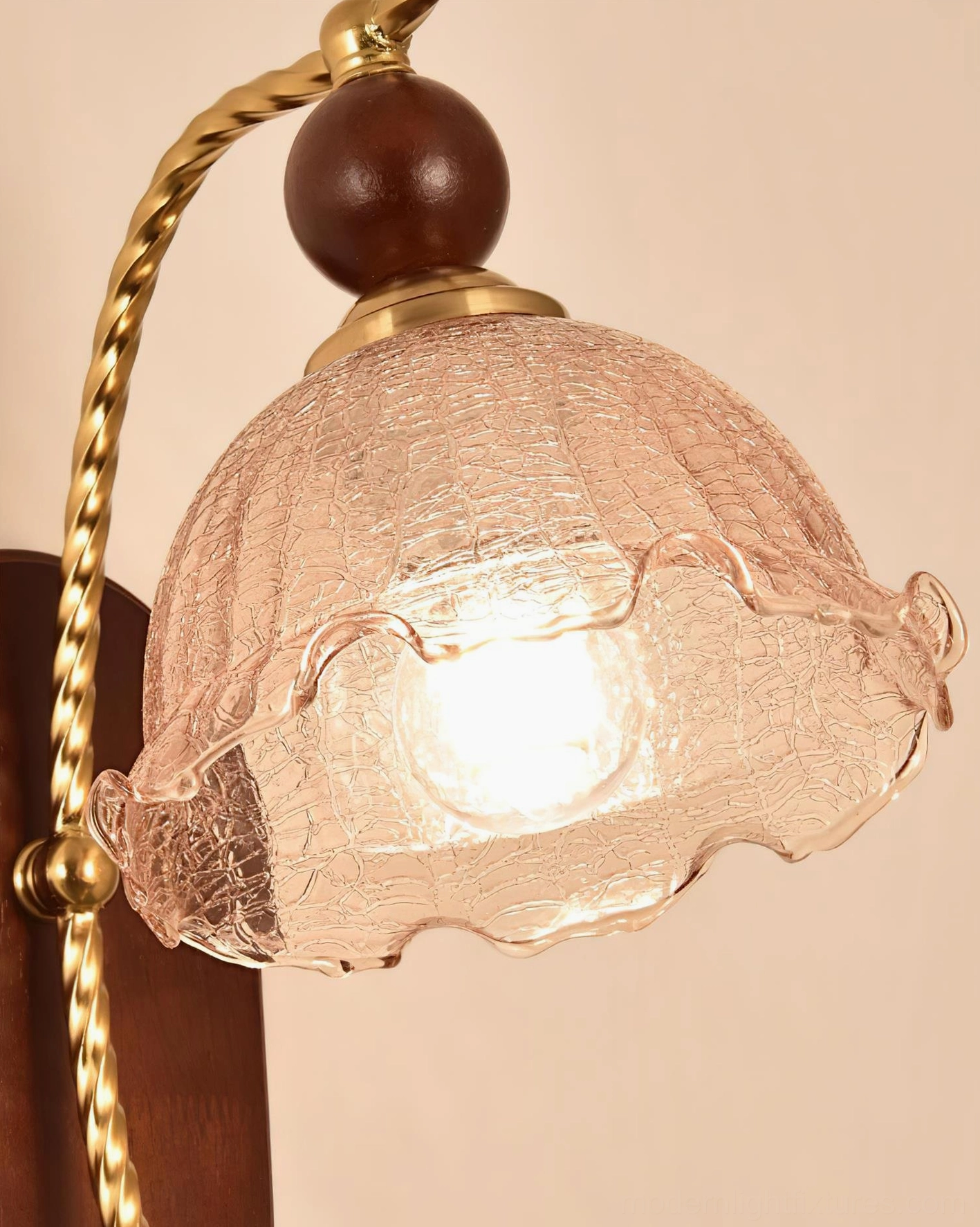 Calyx vintage wall sconce with decorative glass shade and twisted brass accent details