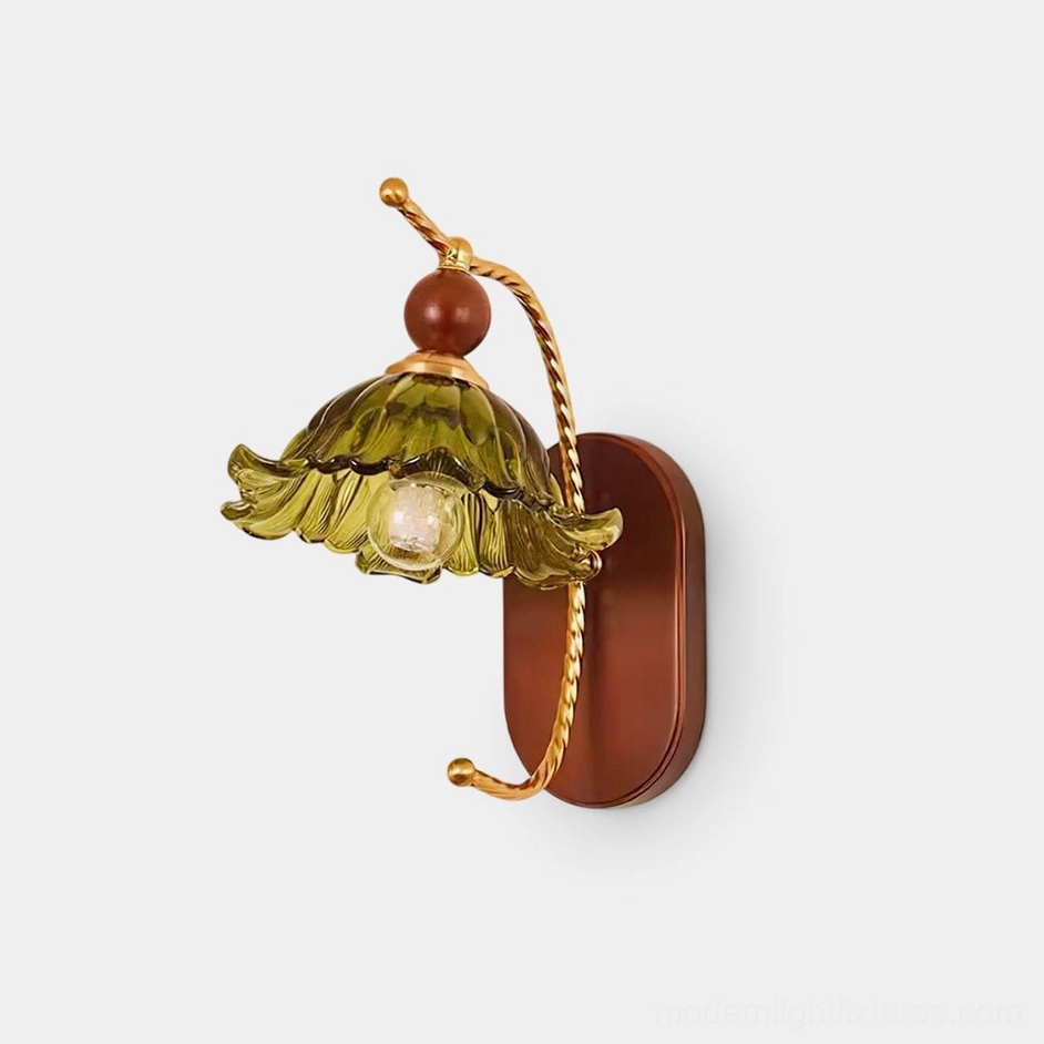 Calyx vintage wall sconce with green ruffled glass shade and twisted brass arm on studio white background