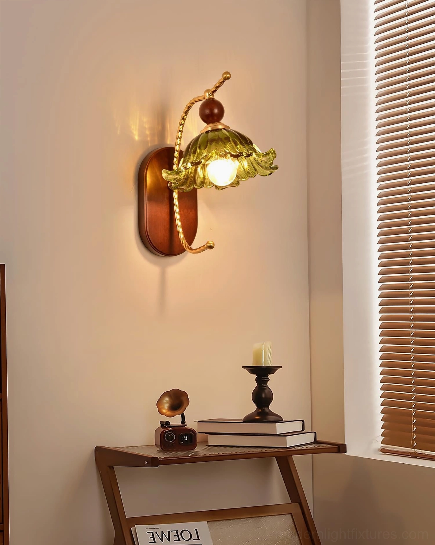 Calyx decorative wall lamp with warm glowing amber ruffled glass shade in bedroom window setting