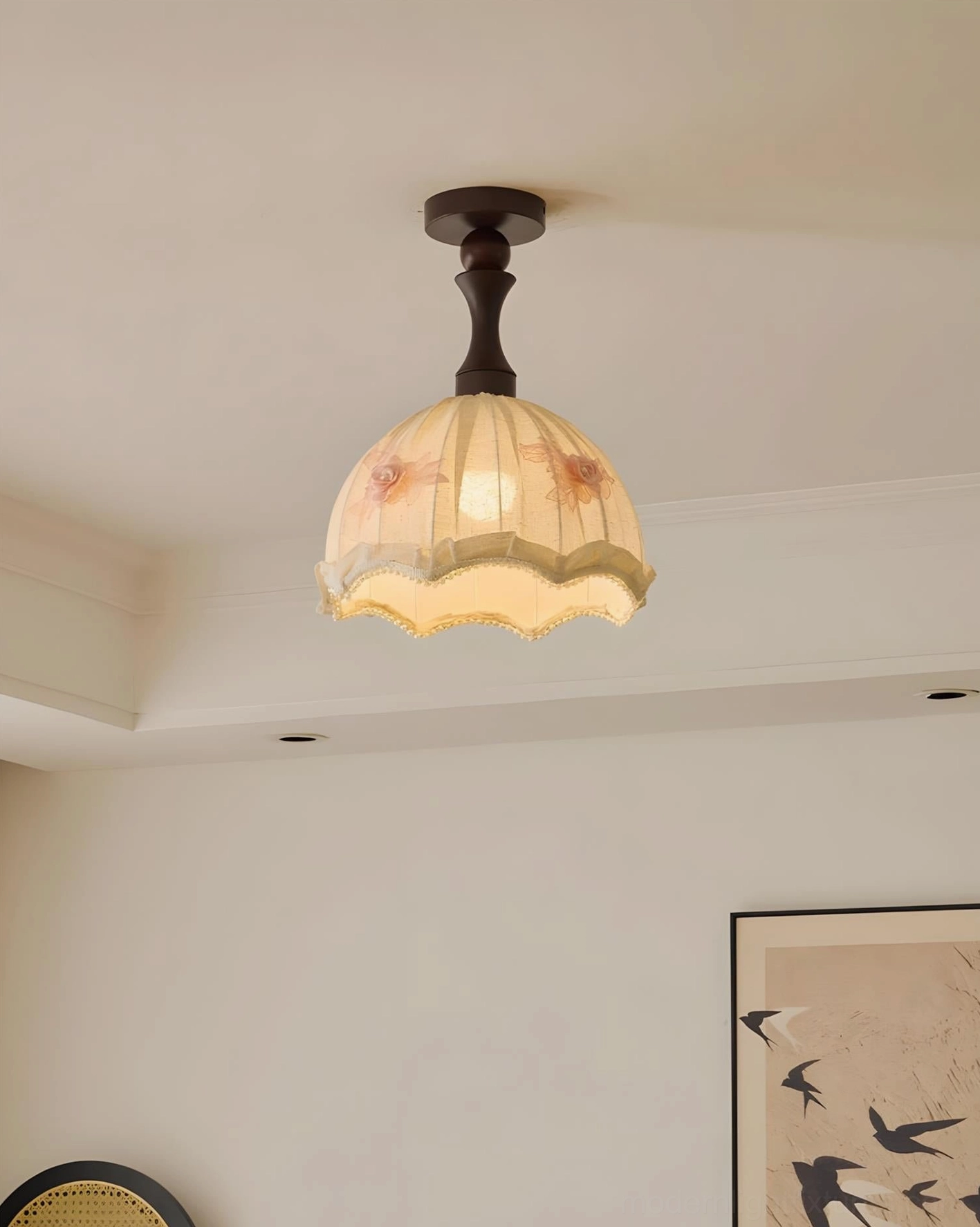 Camélia ceiling lamp close-up with linen shade and floral appliqués against beige wall background