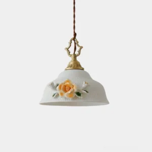 Camellia Grace handcrafted ceramic pendant light with 3D floral relief on ribbed white shade, studio front view