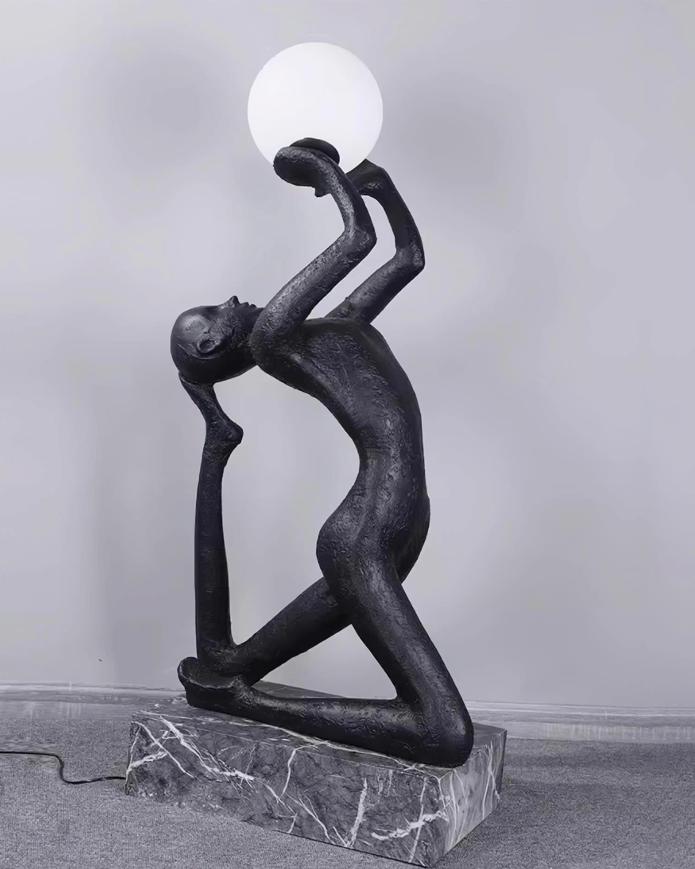 Camilla reverse pose kneeling sculpture floor lamp back view with square marble base