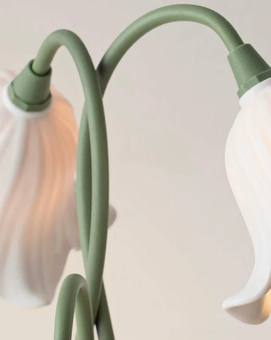 Campelle lamp close-up macro detail shot showing green curved metal gooseneck stems, acrylic bloom petals, and stem joint connection detail