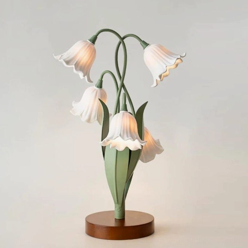 Campelle lily-of-the-valley lamp side three-quarter view highlighting layered acrylic petal texture and green gooseneck stem curvature