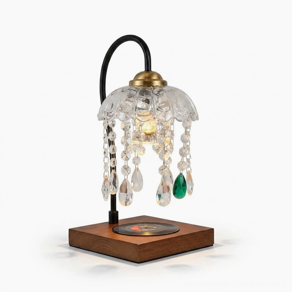 Black metal gooseneck candle warmer lamp with square wood base, crystal-beaded hanging strands, and brass-tone cap on glass dome