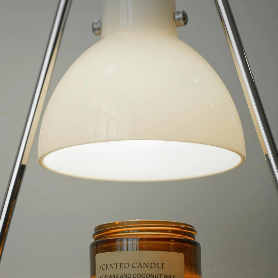 Contemporary candle warmer lamp close-up showing metal frame construction and glass shade quality