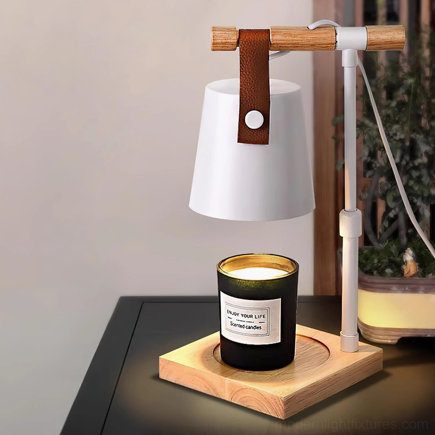 Candle warmer lamp with leather-wrapped wooden handle detail, modern table lamp design close-up view