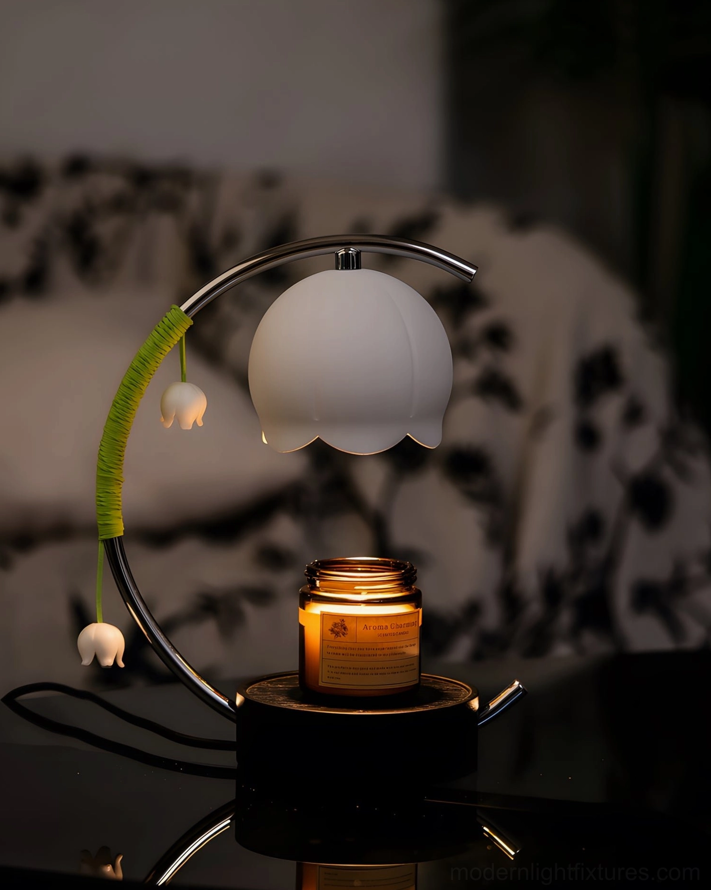 Lily of the Valley Candle Warmer Lamp with lit glass jar candle on dark glossy table in cozy living room environment