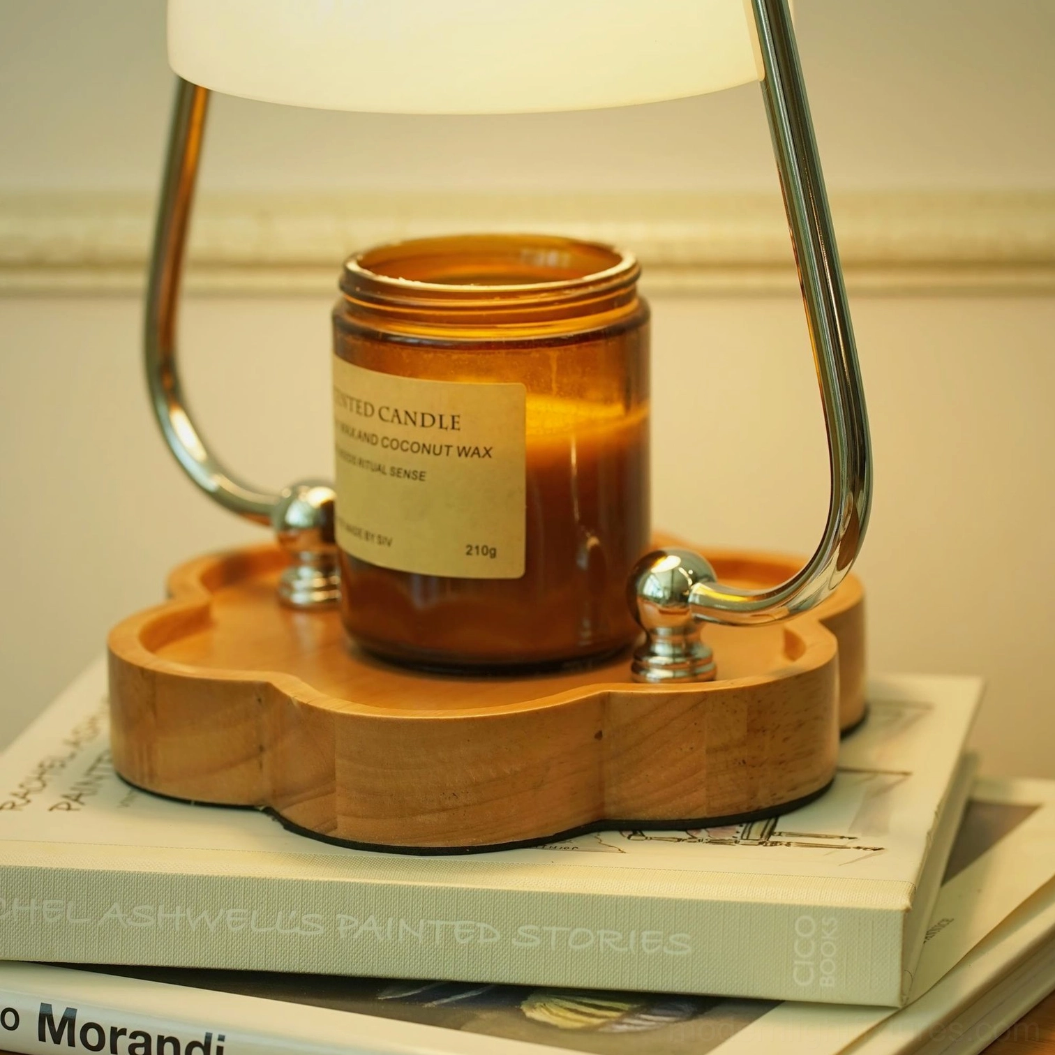 Elegant candle warmer lamp detail showing top ring handle and chrome metal frame