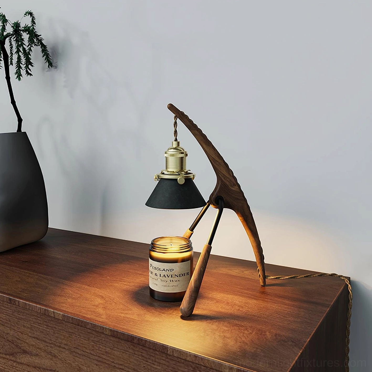 Black walnut wood candle warmer lamp side profile with lit halogen heat, scented candle on wooden table