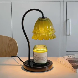 Contemporary candle warmer lamp on home office desk with elegant cabinet backdrop