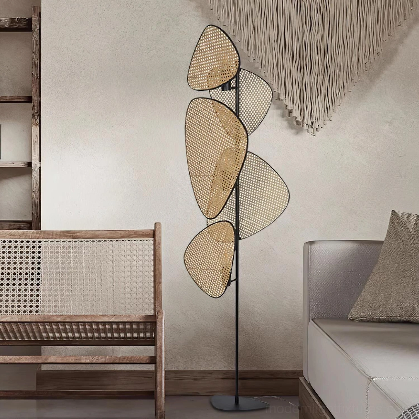 Cannage rattan floor lamp in bohemian living space with daybed and macramé wall decoration