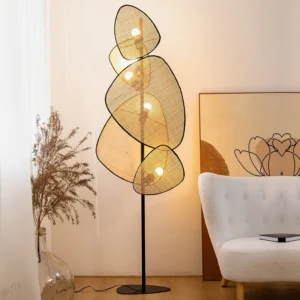 Lit cannage floor lamp illuminated in warm living room setting, side view with shadow patterns on wall