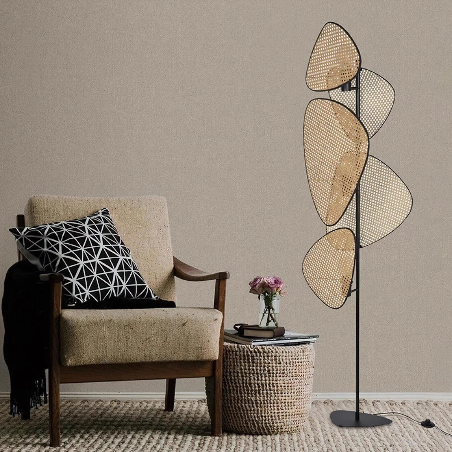Cannage rattan floor lamp in cozy reading nook corner with fabric armchair and woven side table