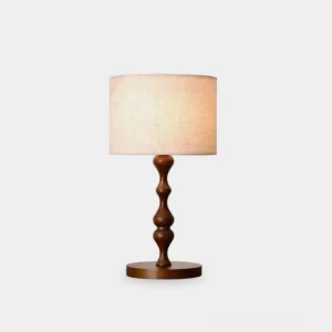 Canora wooden table lamp with ash wood base and beige fabric drum shade, front studio view