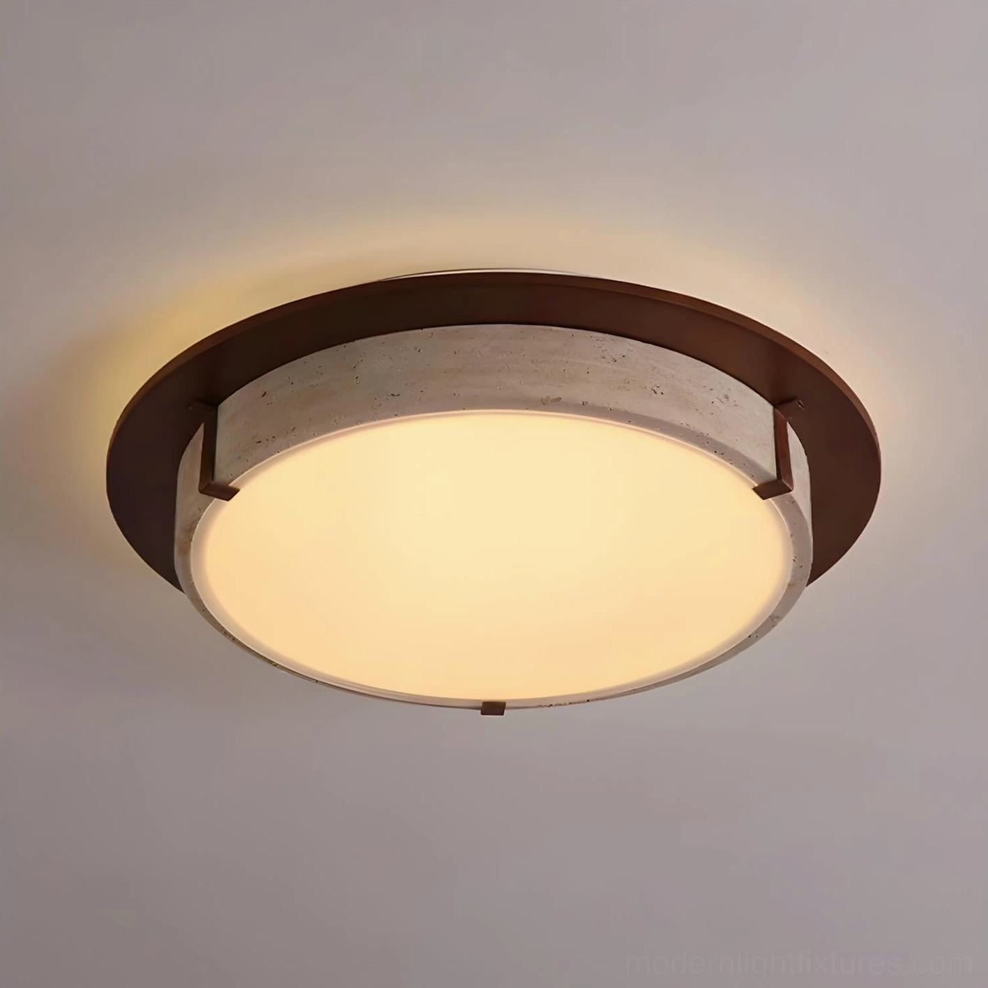 Illuminated Cantera ring ceiling lamp showing warm 3000K LED glow and travertine stone detail