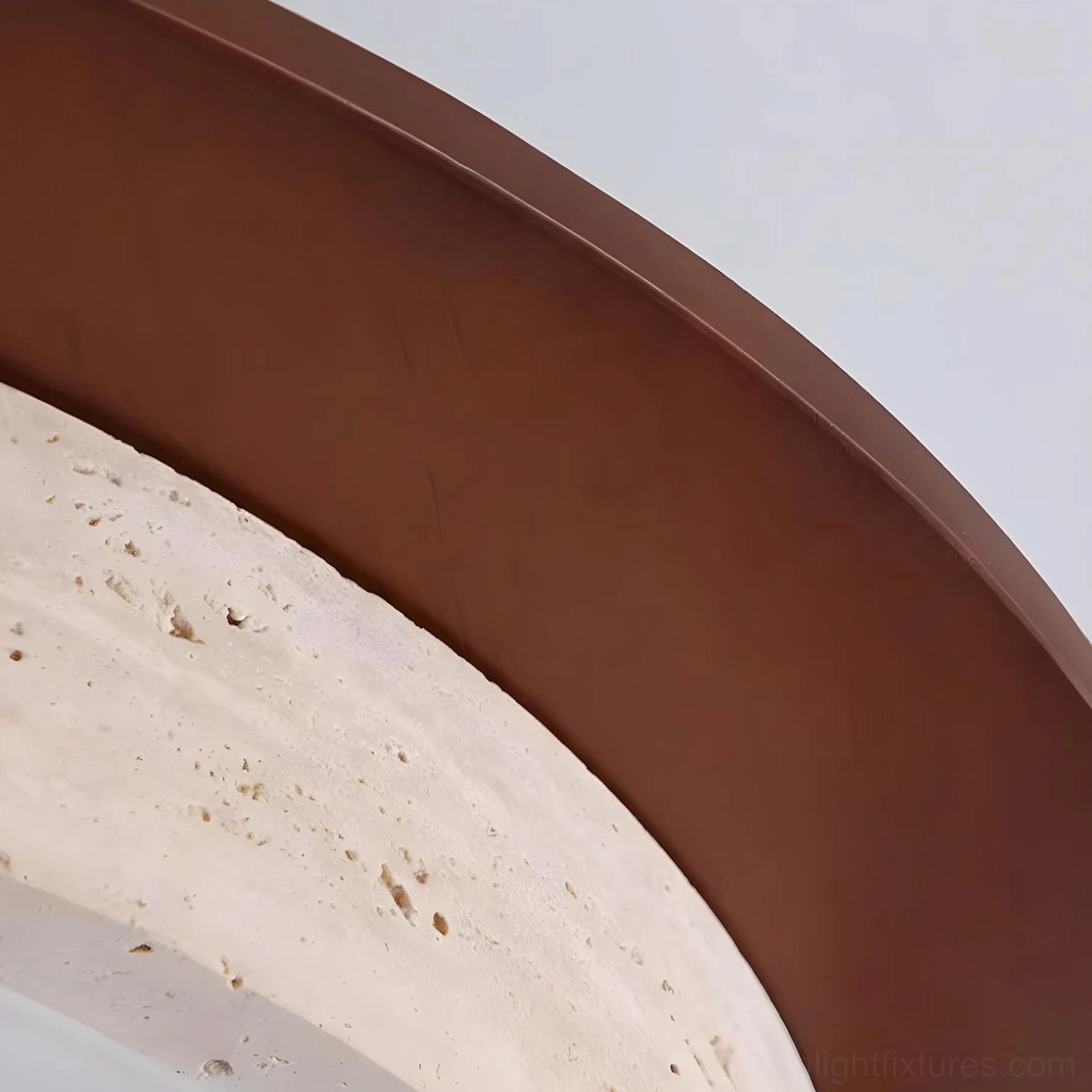 Cantera ring ceiling lamp showcasing contemporary circular geometry and refined material contrast