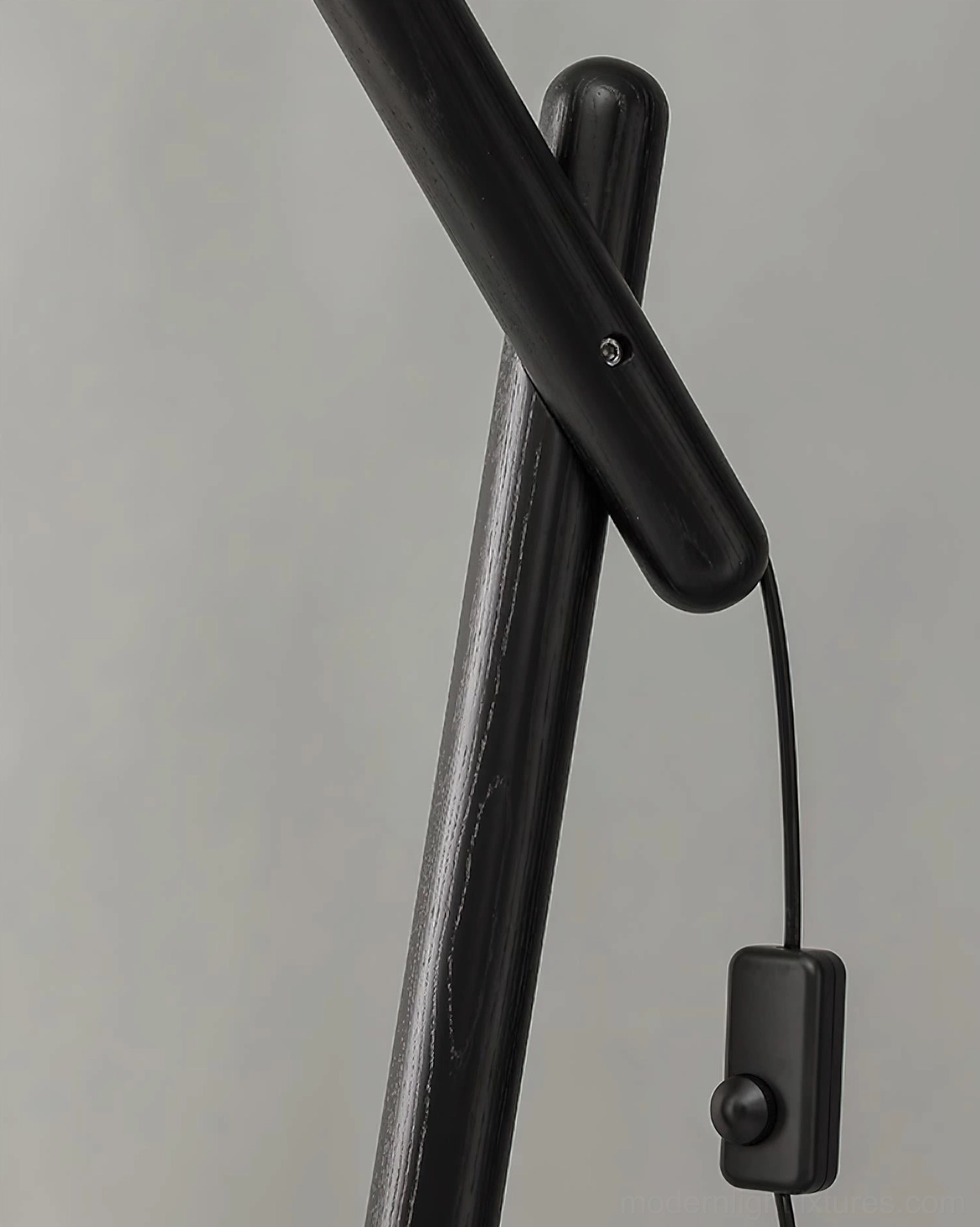 Cantilever floor lamp with weighted round base and fabric shade in contemporary interior design