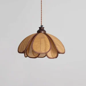 Natural woven rattan pendant lamp Capelina showing petal-shaped shade design and dark wood socket hardware