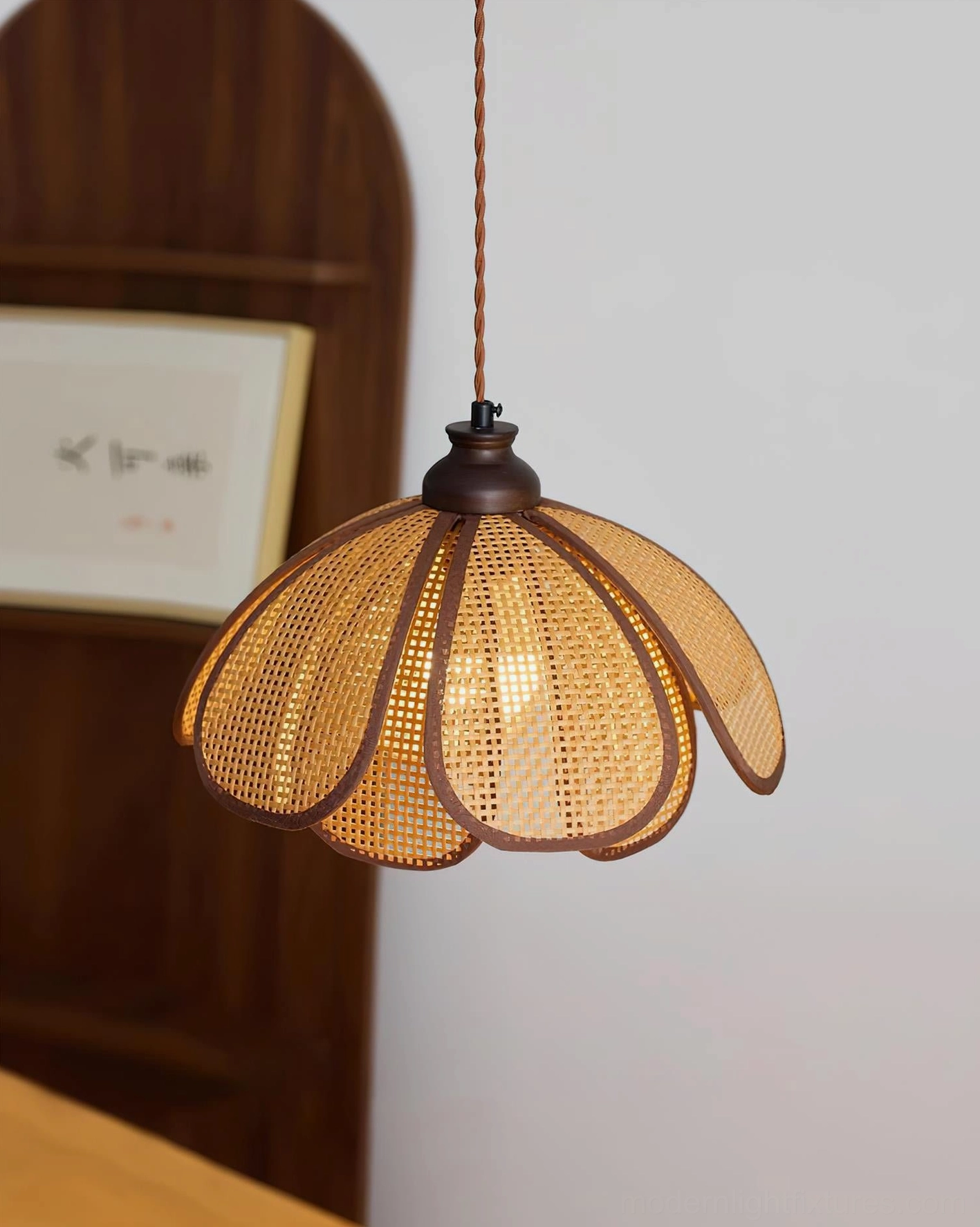 Capelina natural rattan petal pendant light fixture with adjustable wire and walnut wood socket detail