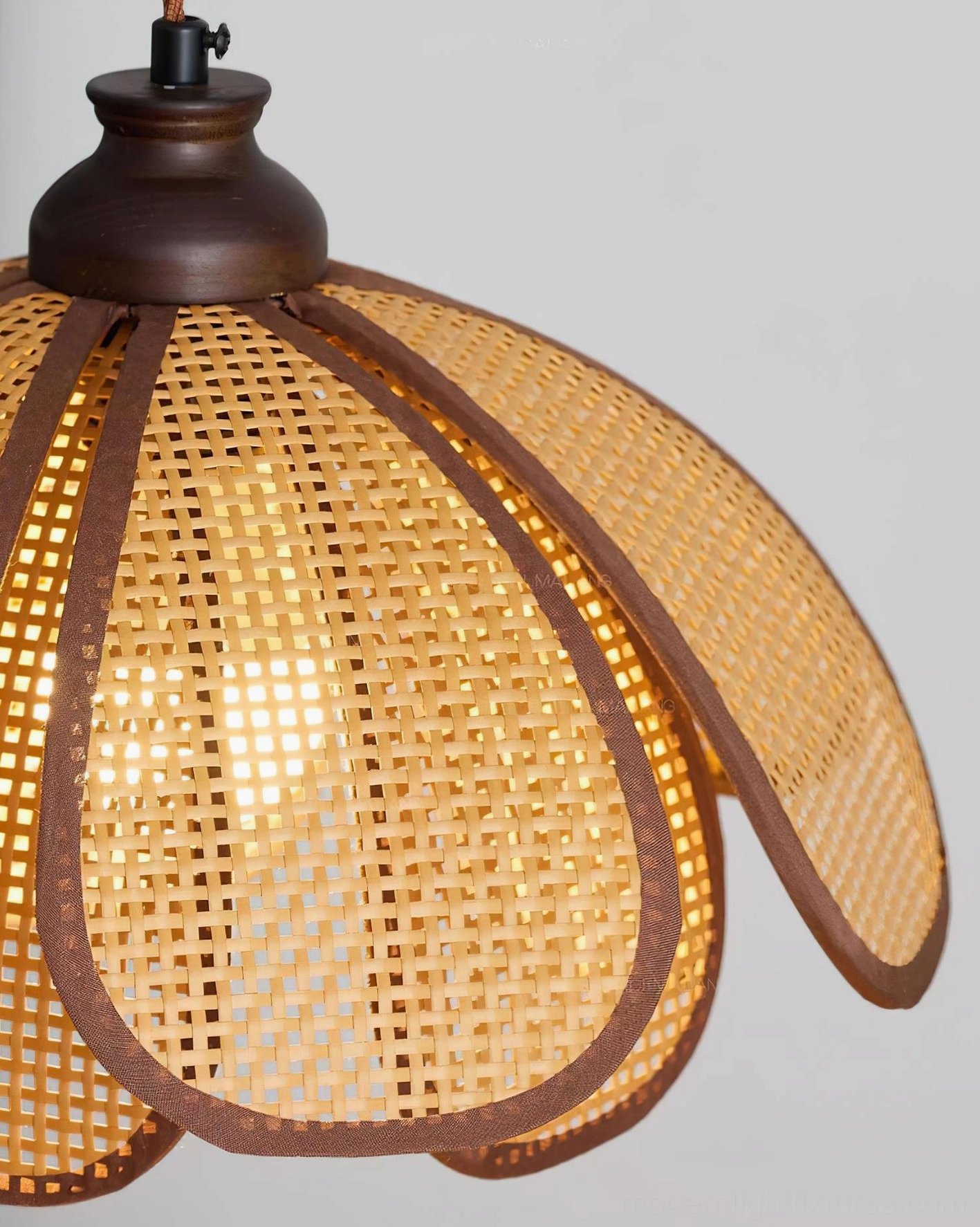 Capelina rattan petal pendant light with warm diffused lighting in contemporary bohemian interior design