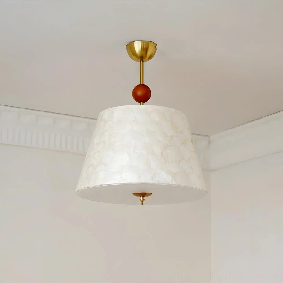 Close-up detail of Capella mid-century modern ceiling pendant, tapered silhouette with fabric shade and sculptural wood accent