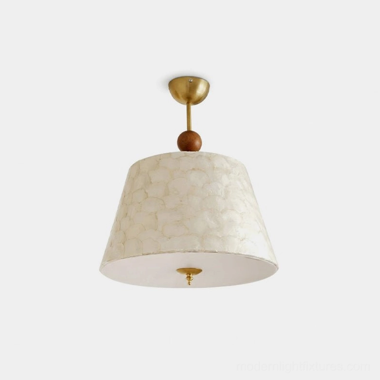 Capella modern ceiling pendant light with brass gold finish, walnut wood accent bead, and off-white textured fabric shade - front studio view