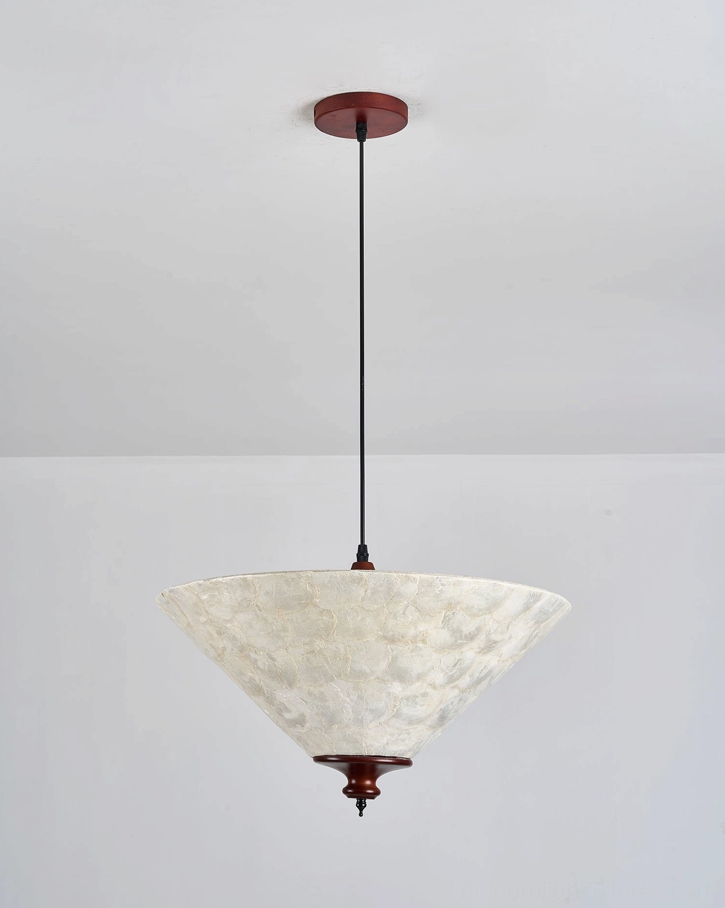 Capelle capiz shell pendant light bottom-up view showing tapered cone shade and dark walnut wood finial, studio photography