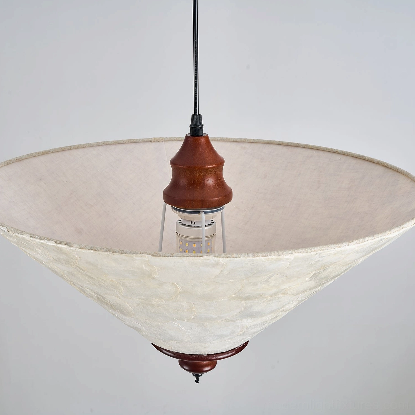 Capelle capiz shell pendant light E27 bulb socket warm white light glowing through pearly cream translucent shell panels