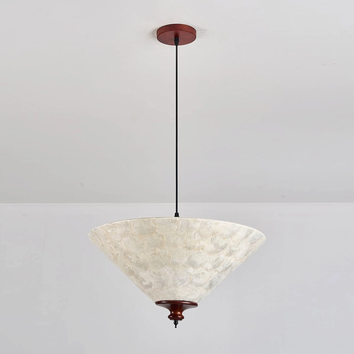 Capelle capiz shell pendant light front studio view cream pearly mottled shell and dark reddish-brown walnut wood base hardware
