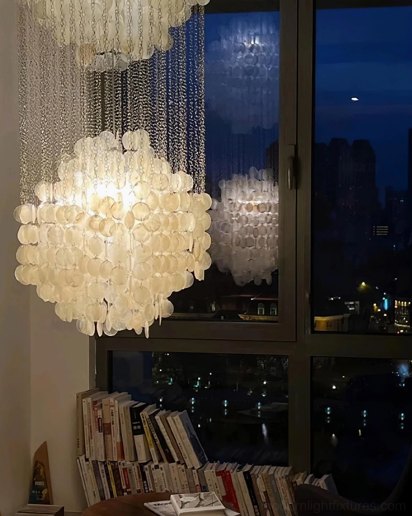 White capiz shell pendant light detail showing shell translucency and metal suspension mechanism functionality