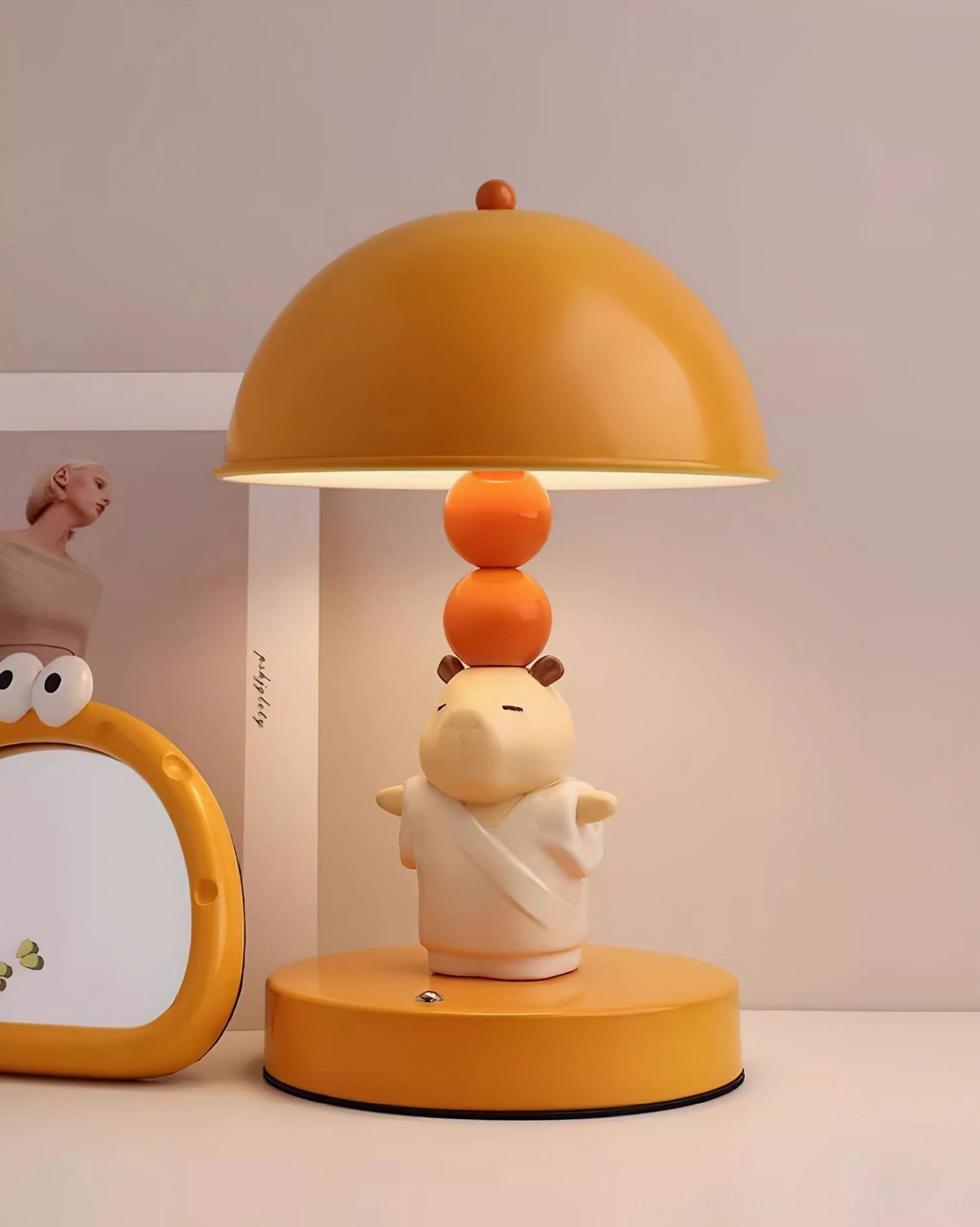 Capybara table lamp close-up showing warm fabric lampshade and light diffusion