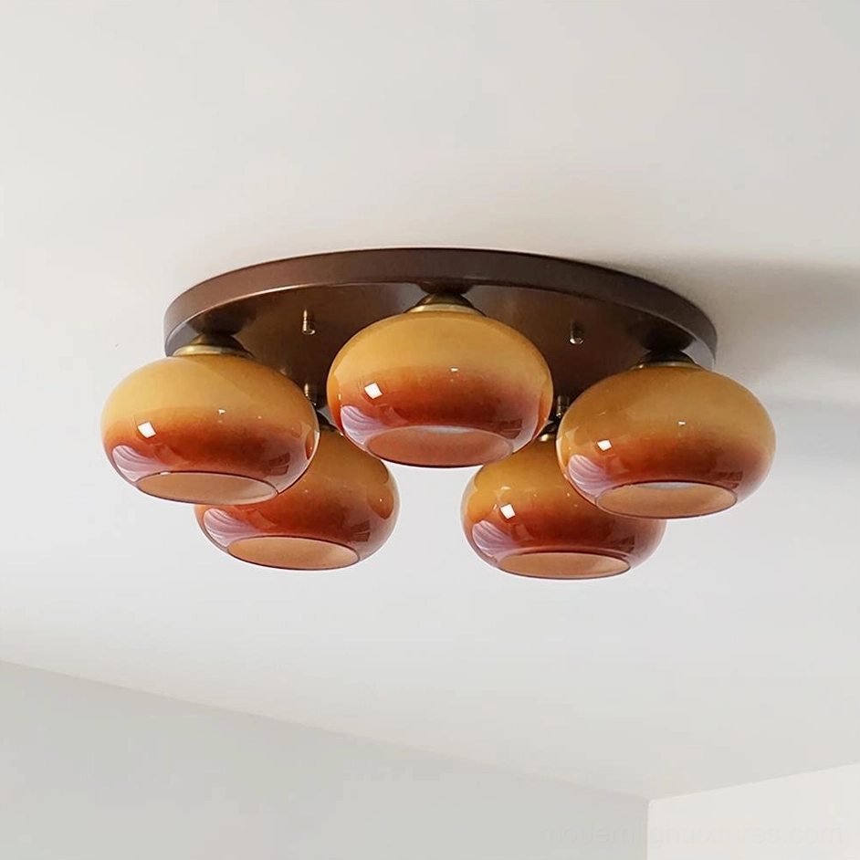 Caramel color 5-head glass ceiling flush mount fixture with frosted handblown orbs - side profile view