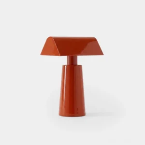 Caret cordless pyramid table lamp in red lacquered steel, front studio view