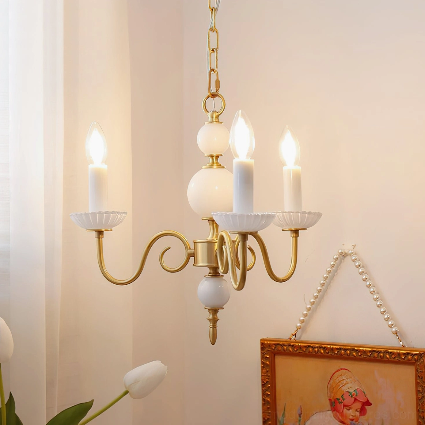 Vintage French style brass chandelier with curved arms and ceramic candle accents