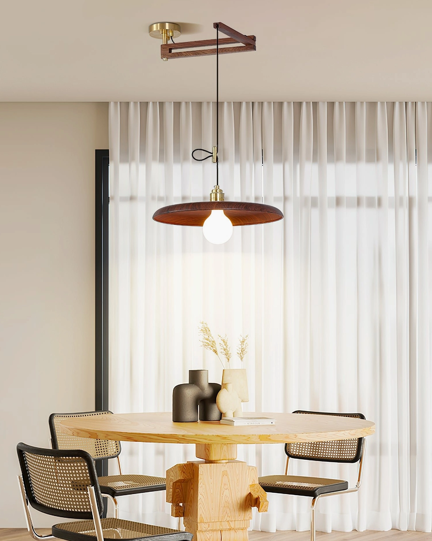 Warm minimalist dining area with Carlyle pendant lamp and place setting