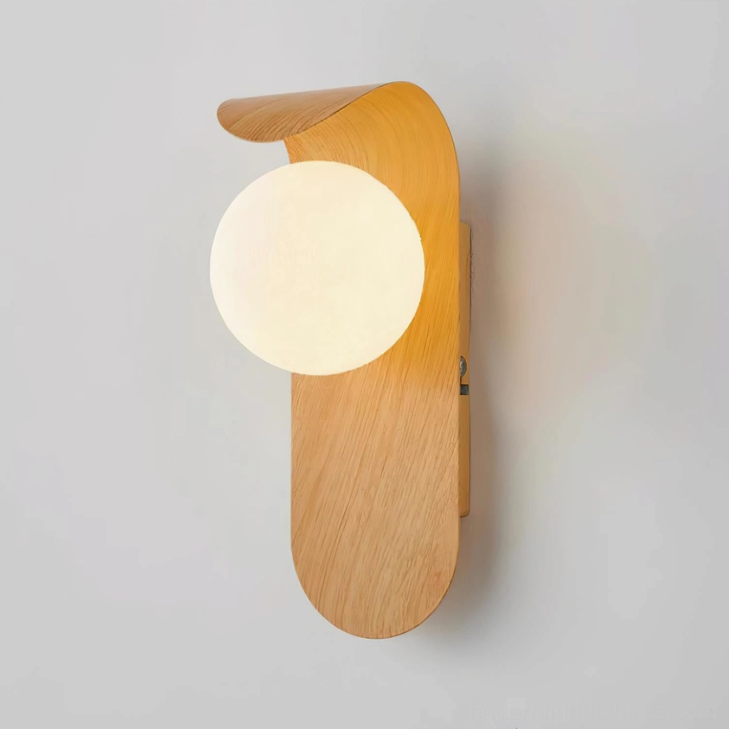 Carlyle wooden sconce above console table creating layered lighting in contemporary living space