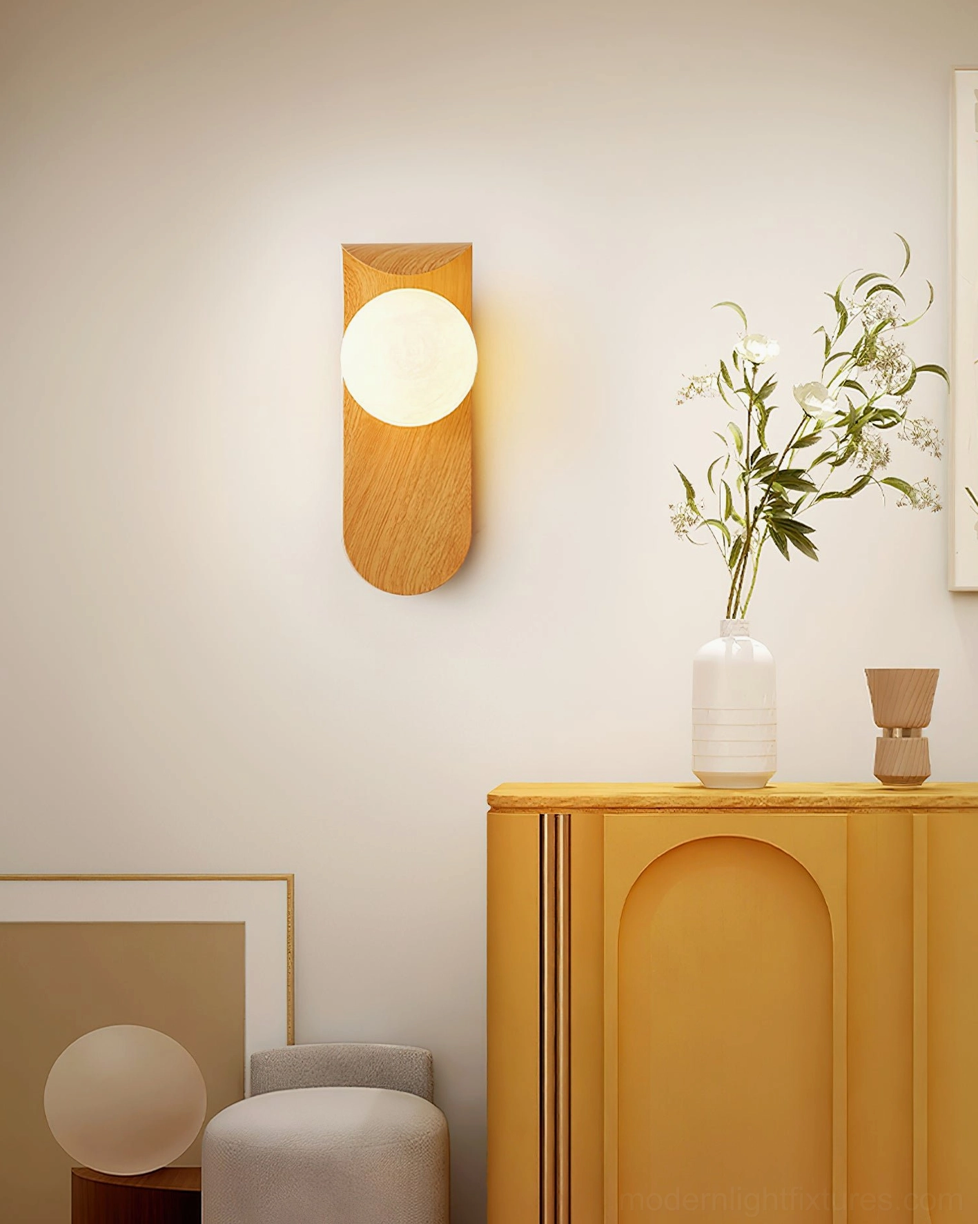 Carlyle wood-finish wall sconce side profile showing curved metal arm extension and glass globe