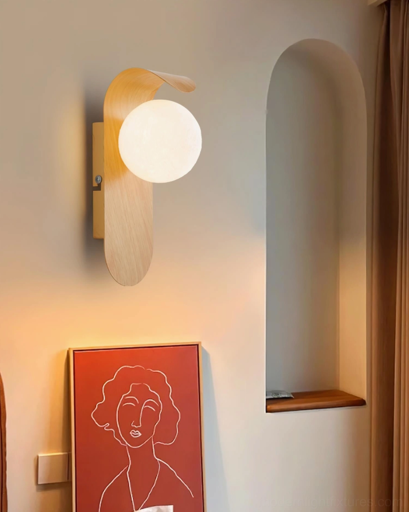 Carlyle wall sconce walnut color finish installed in bedroom creating warm ambient lighting