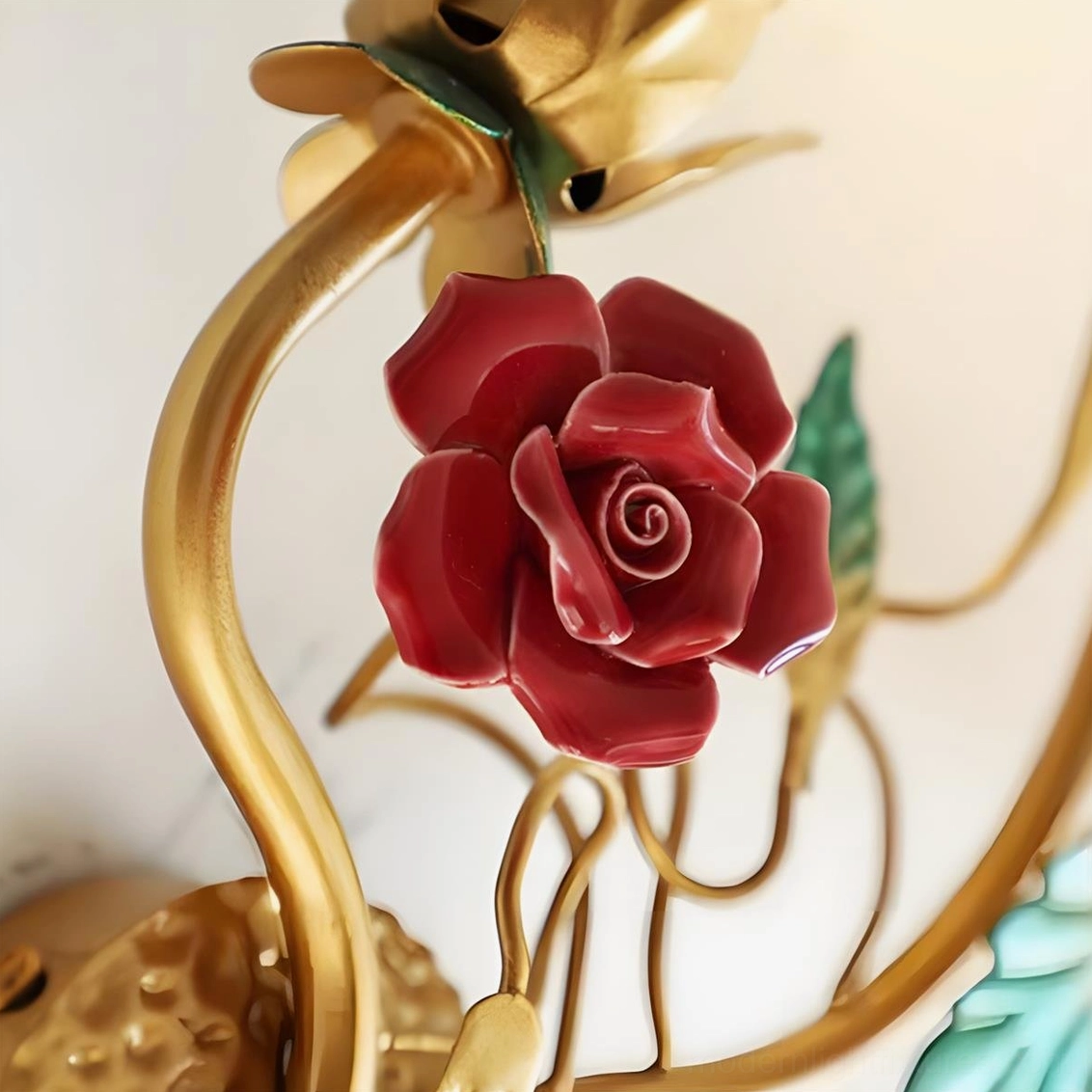Carmelia floral wall sconce with dual candle configuration and romantic gold finished metal frame design