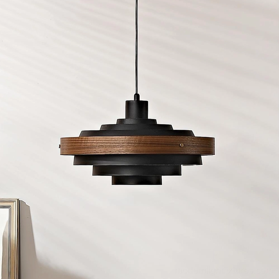 Carmen layered pendant lamp in black and walnut wood colorway, architectural form with geometric disc stacking