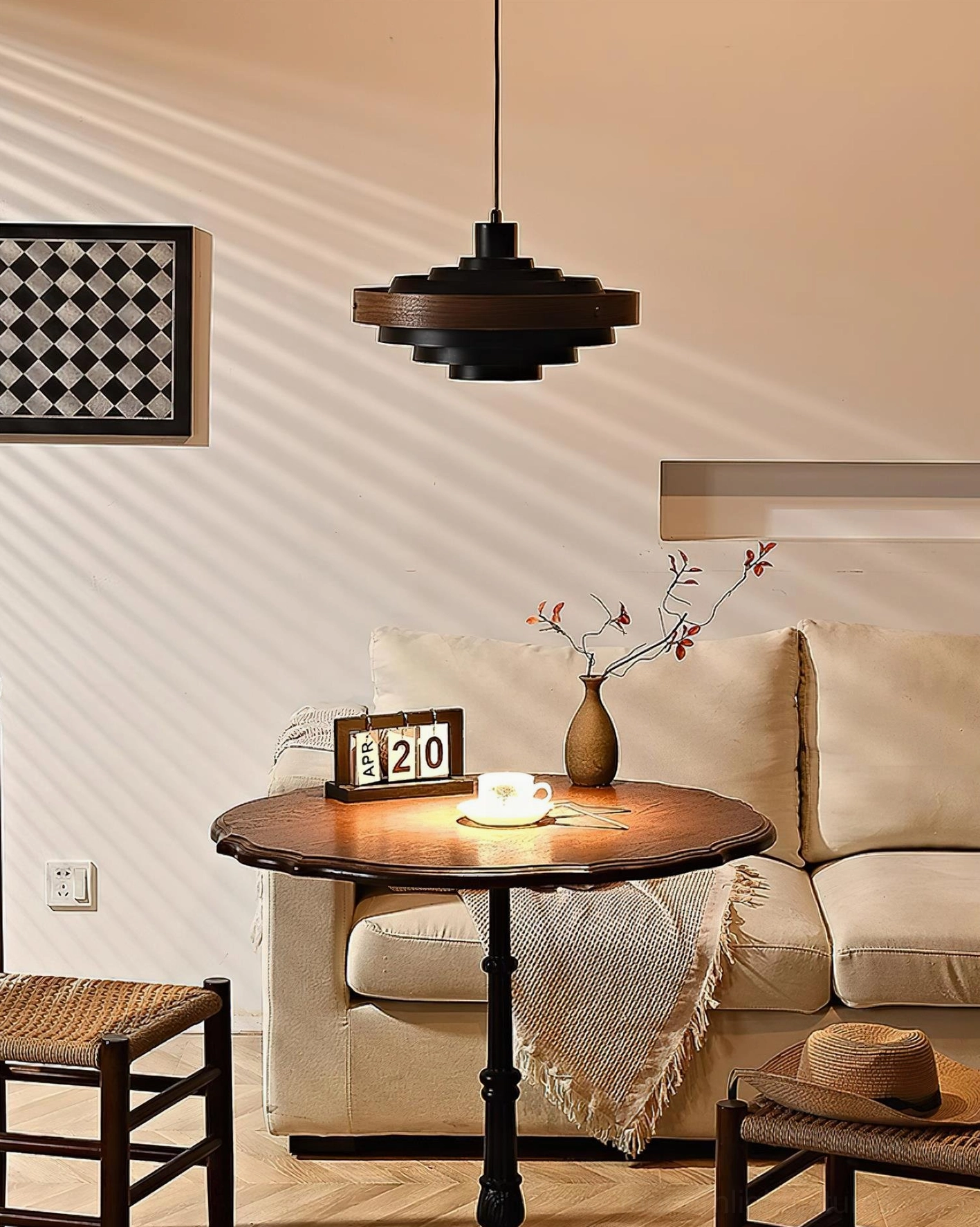 Carmen pendant light in contemporary kitchen setting, mid-century modern tiered disc design as functional art