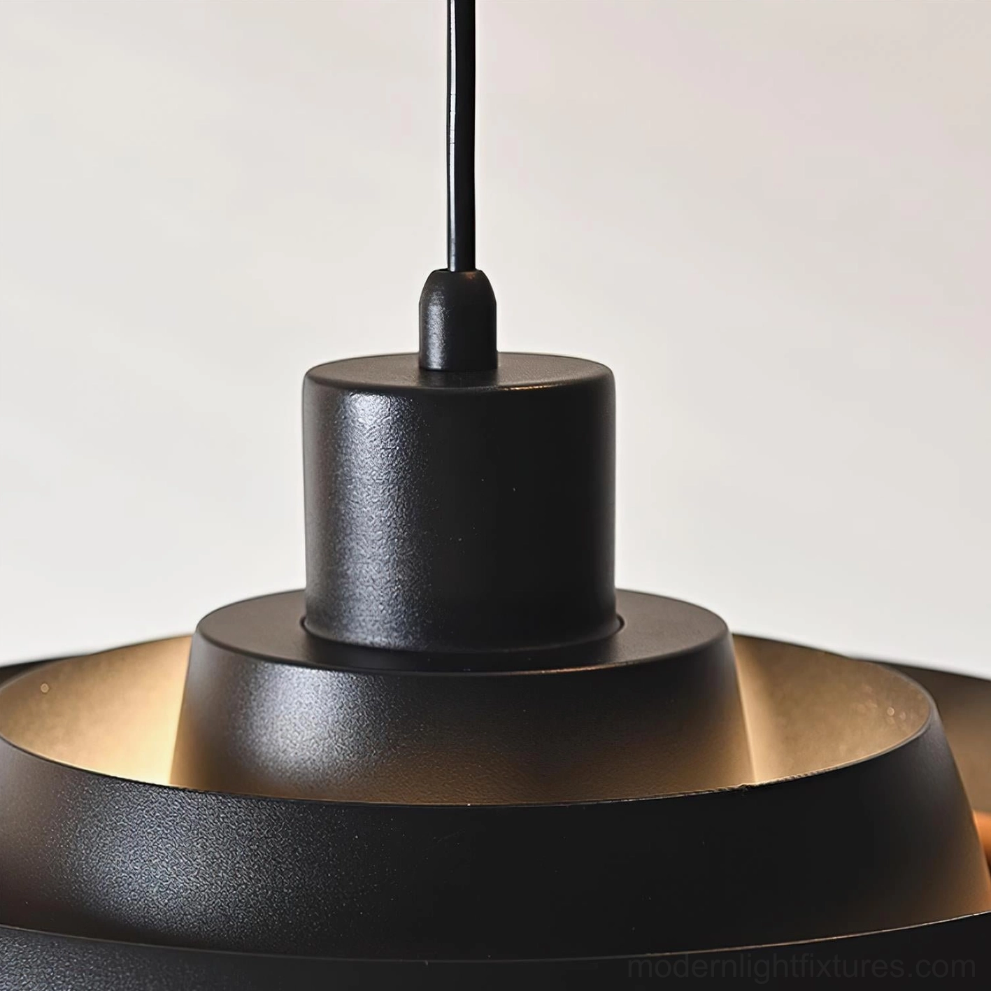 Carmen tiered pendant light installed in residential interior, modern pendant lamp above dining or work surface
