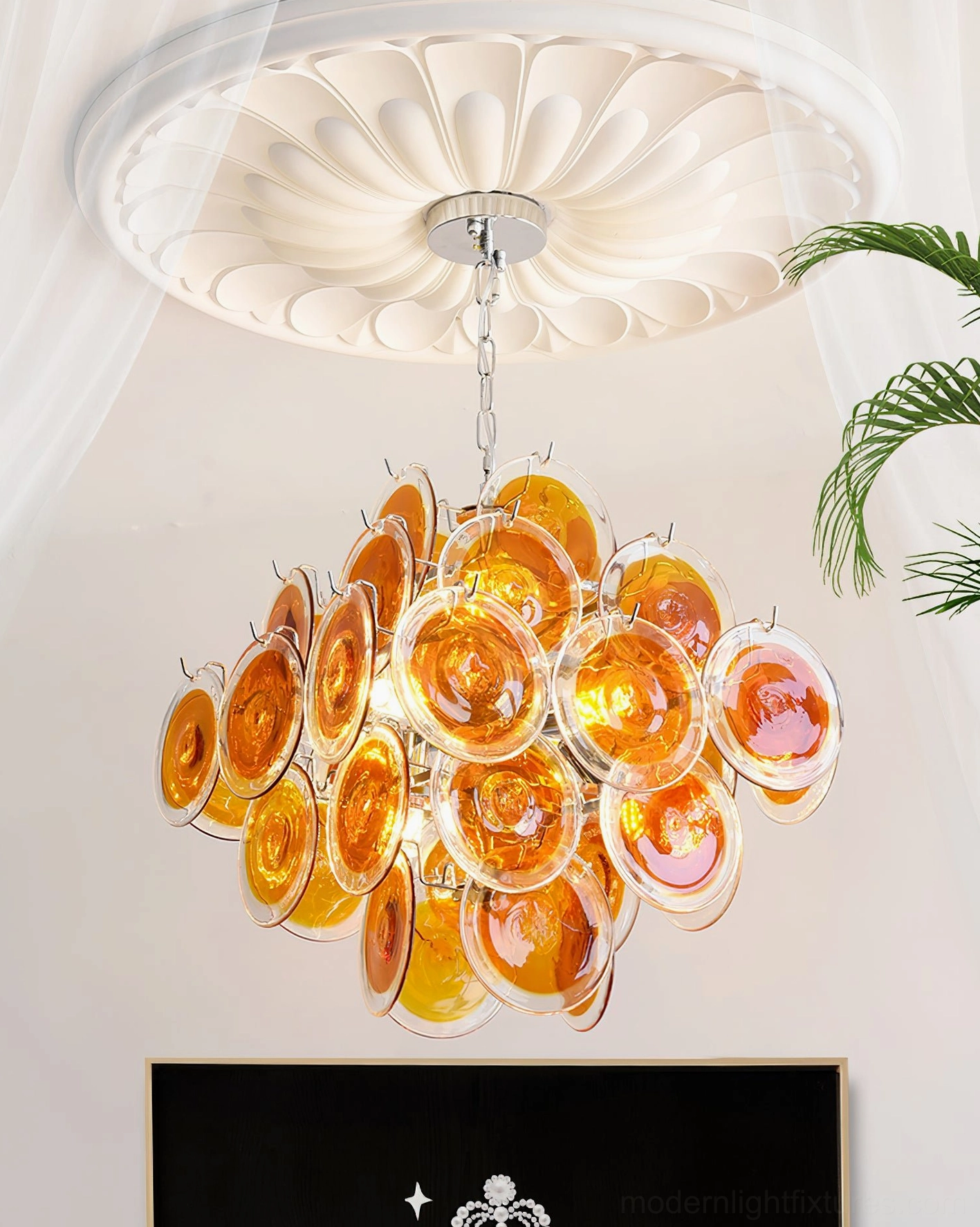 Carmosa glass disc chandelier elegant installation view in upscale residential interior with sophisticated decor