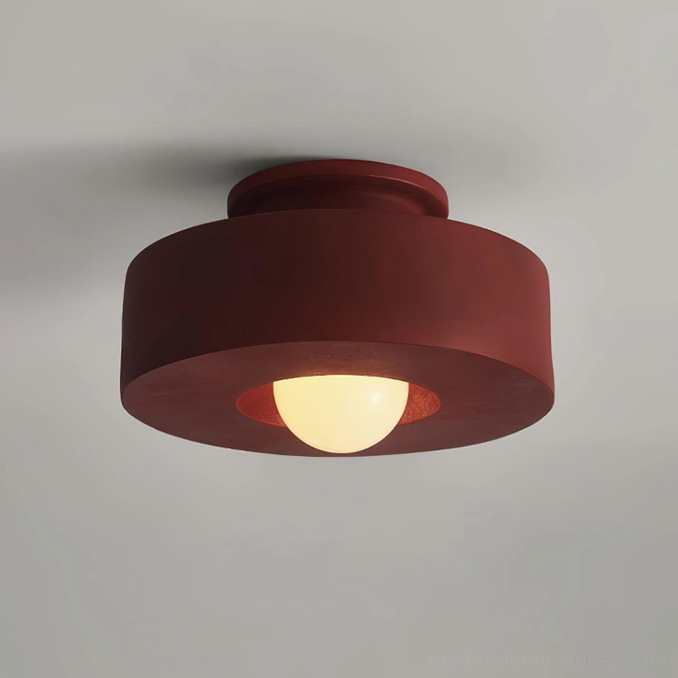 Carneros flush-mount ceiling light fixture in red, three-quarter close-up angle highlighting stacked resin geometry